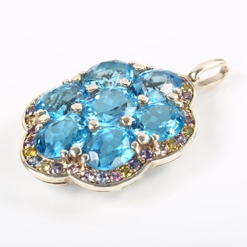 245 - A modern sterling silver blue topaz and vari-hue sapphire cluster pendant, set with oval mixed-cut t... 