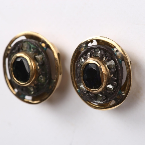 246 - A pair of sapphire and diamond cluster earrings, unmarked gold settings with oval mixed-cut sapphire... 