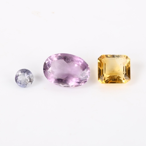 372 - 3 unmounted gemstones, including 0.8ct iolite, 4.8ct citrine, and 6.75ct amethyst, all with GLI repo... 