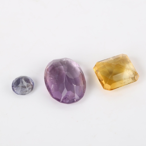 372 - 3 unmounted gemstones, including 0.8ct iolite, 4.8ct citrine, and 6.75ct amethyst, all with GLI repo... 