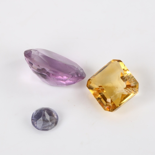 372 - 3 unmounted gemstones, including 0.8ct iolite, 4.8ct citrine, and 6.75ct amethyst, all with GLI repo... 