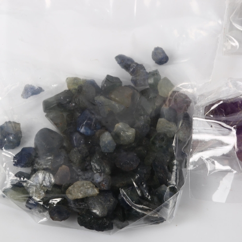 374 - 5 groups of rough unmounted gemstones, including 77.1ct blue sapphire, 50ct tanzanite, 41.2ct rainbo... 