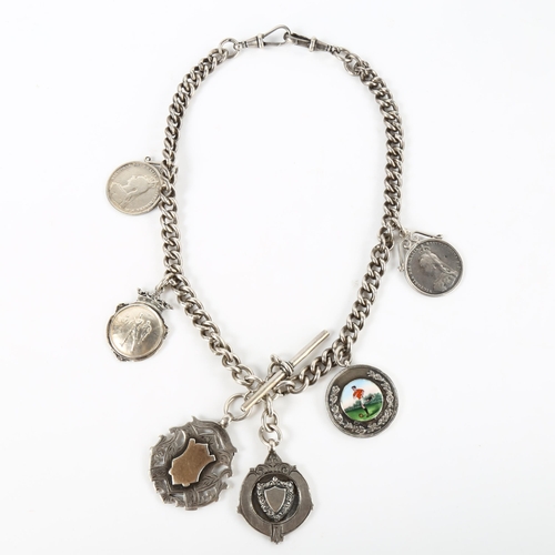 388 - FOOTBALL INTEREST - an early 20th century silver curb link Albert chain, with 6 silver fobs and meda... 