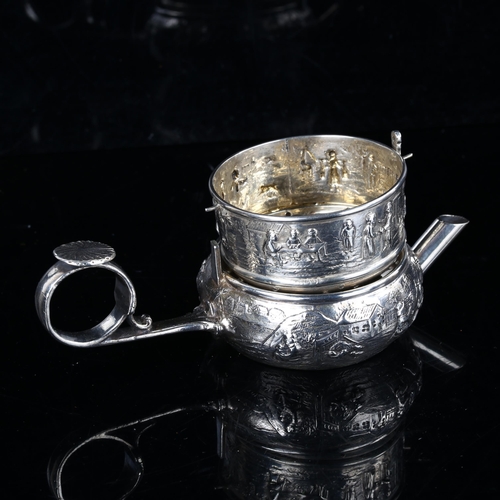 401 - An unusual small Dutch unmarked silver teapot and strainer, relief embossed figural decoration, bowl... 