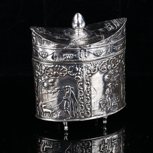 406 - A 19th century Dutch silver tea caddy, navette form with relief embossed figural and foliate decorat... 