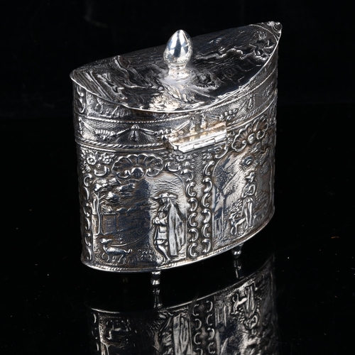 406 - A 19th century Dutch silver tea caddy, navette form with relief embossed figural and foliate decorat... 