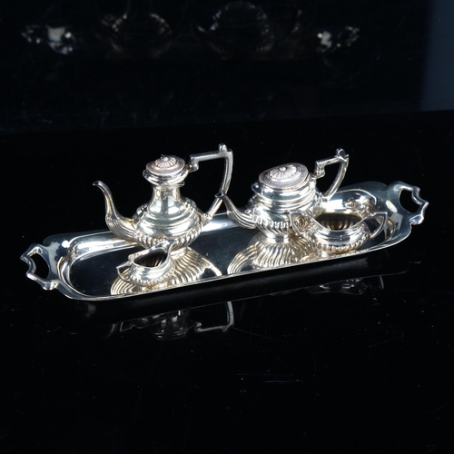 421 - An Elizabeth II miniature silver 5-piece doll's tea set, comprising 2-handled tray, hot water jug, t... 