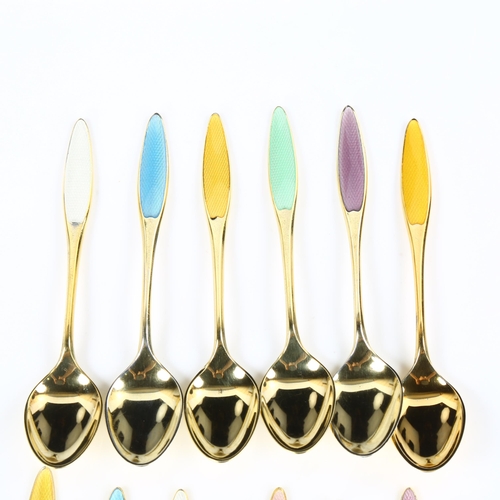 425 - FRIGAST - a set of 12 Danish vermeil sterling silver and harlequin enamel coffee spoons, designed by... 