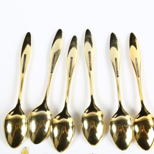 425 - FRIGAST - a set of 12 Danish vermeil sterling silver and harlequin enamel coffee spoons, designed by... 