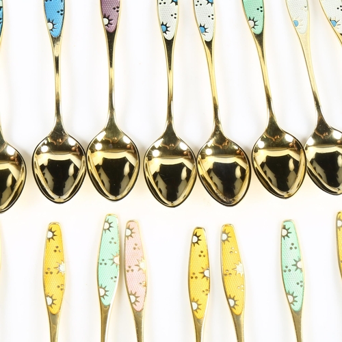 428 - FRIGAST - a set of 15 Danish vermeil sterling silver and harlequin enamel sunburst coffee spoons, an... 