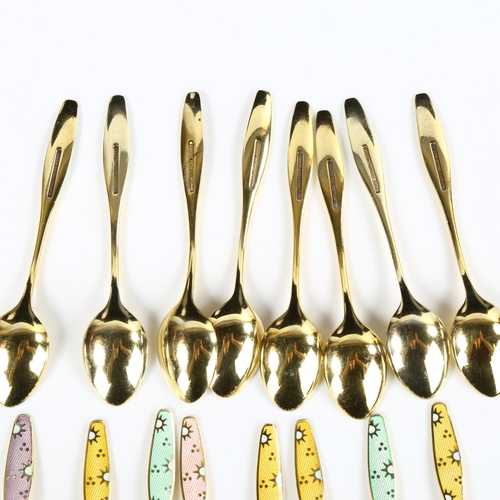 428 - FRIGAST - a set of 15 Danish vermeil sterling silver and harlequin enamel sunburst coffee spoons, an... 