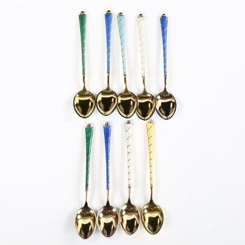 429 - EGON LAURIDSEN - a set of 9 Danish vermeil sterling silver and harlequin enamel coffee spoons, with ... 