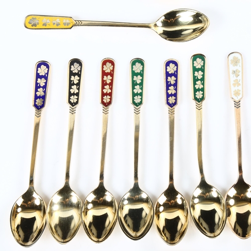 434 - EGON LAURIDSEN - a set of 14 Danish vermeil sterling silver and harlequin enamel shamrock coffee spo... 