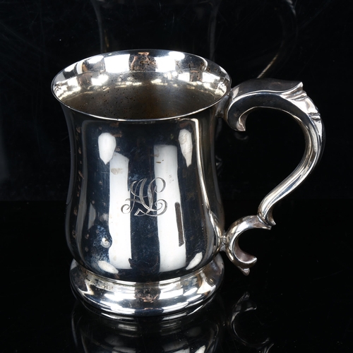 438 - An Elizabeth II silver half pint mug, baluster form with acanthus handle, by Viner's Ltd, hallmarks ... 