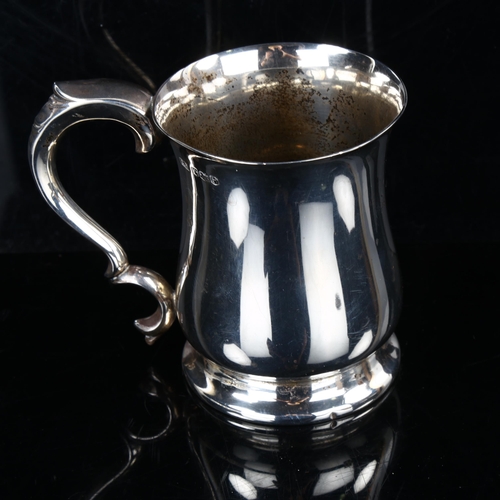 438 - An Elizabeth II silver half pint mug, baluster form with acanthus handle, by Viner's Ltd, hallmarks ... 