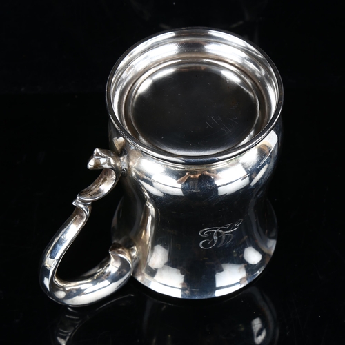 438 - An Elizabeth II silver half pint mug, baluster form with acanthus handle, by Viner's Ltd, hallmarks ... 