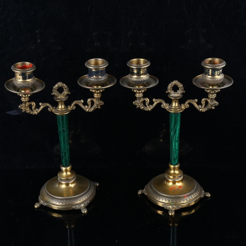 440 - A pair of Italian silver-gilt malachite twin-branch table candlesticks, with foliate supports and li... 