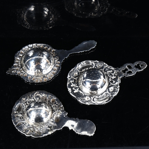 450 - 3 Continental silver tea strainers, allover relief embossed decoration, largest length 16cm, 5.2oz t... 