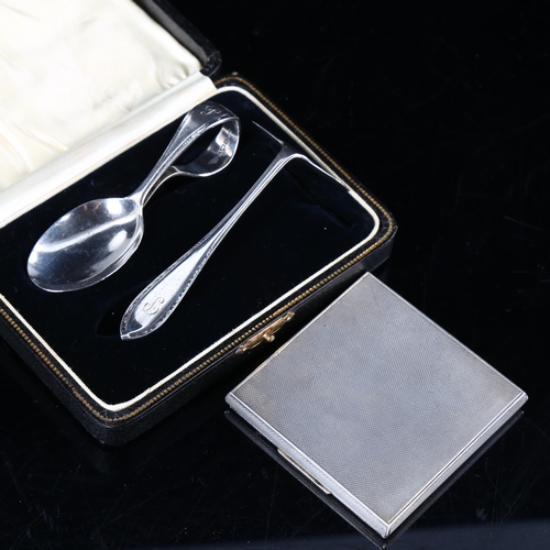 454 - Various silver, comprising engine turned compact, and christening spoon and pusher set, cased (2)