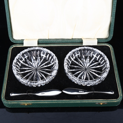 461 - A pair of glass butter dishes, with silver butter knives, hallmarks Sheffield 1937, dish diameter 10... 