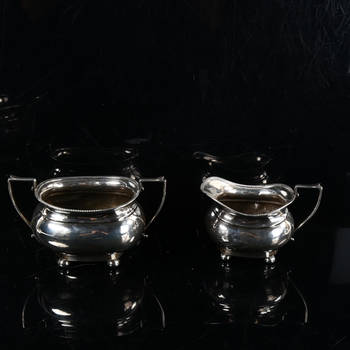 464 - A George V silver 3-piece tea set, comprising teapot, 2-handled sugar bowl and cream jug, in Queen A... 