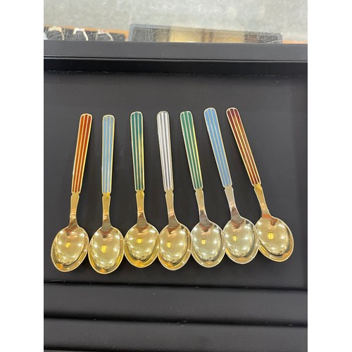 430 - ANTON MICHELSEN - a set of 12 Danish vermeil sterling silver and harlequin enamel coffee spoons, len... 