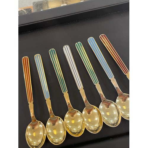 430 - ANTON MICHELSEN - a set of 12 Danish vermeil sterling silver and harlequin enamel coffee spoons, len... 