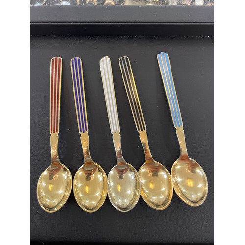 430 - ANTON MICHELSEN - a set of 12 Danish vermeil sterling silver and harlequin enamel coffee spoons, len... 