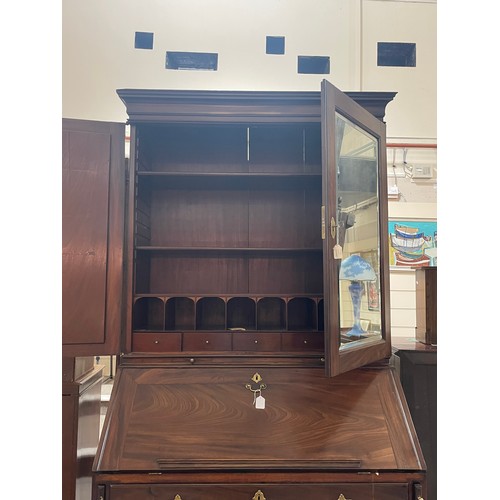 1246 - An impressive George III flame veneer mahogany bureau bookcase, with bevel mirror panelled cupboards... 