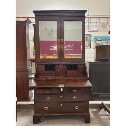 1246 - An impressive George III flame veneer mahogany bureau bookcase, with bevel mirror panelled cupboards... 