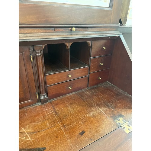 1246 - An impressive George III flame veneer mahogany bureau bookcase, with bevel mirror panelled cupboards... 