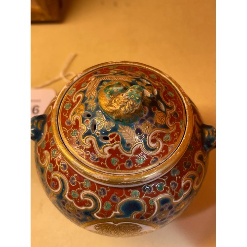 1196 - A Japanese Satsuma porcelain pot pourri pot and cover, brightly coloured painted and gilded decorati... 