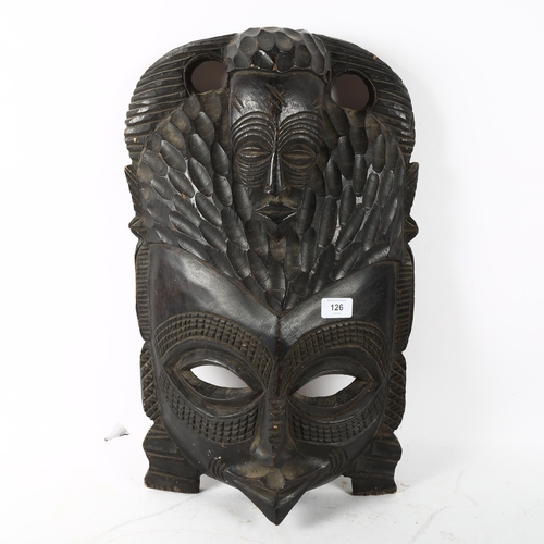 126 - A large African Tribal carved hardwood ceremonial mask, height 55cm