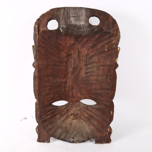 126 - A large African Tribal carved hardwood ceremonial mask, height 55cm