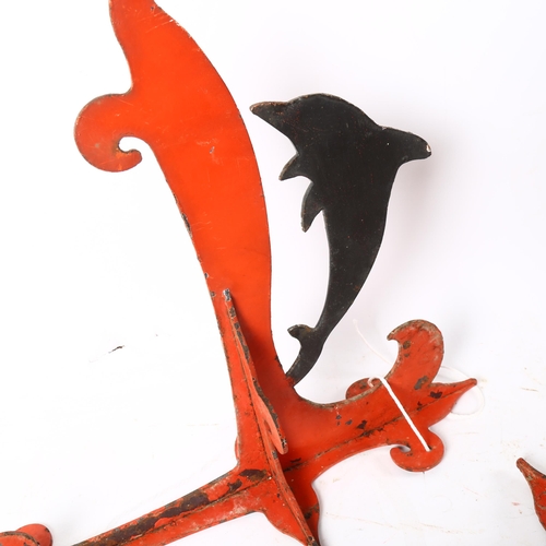 129 - A pair of painted wrought-iron dolphin wall brackets, height 44cm, depth 34cm