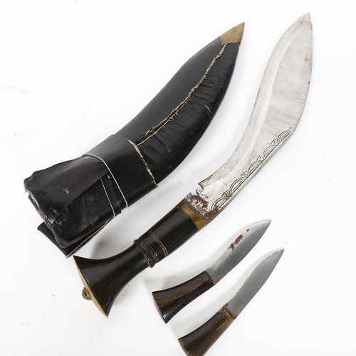 32 - An Indian kukri knife and scabbard, with miniature knives and bone handles, blade length 28cm