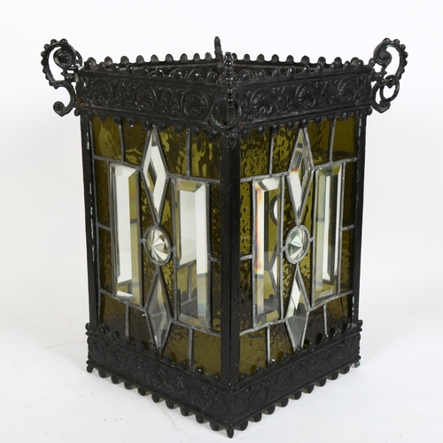 47 - A large stained and cut-glass square-section lantern shade, with embossed frame and leadlight panels... 