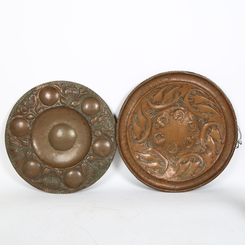 50 - 2 Art Nouveau copper chargers, in Newlyn and Keswick style, unmarked, largest diameter 44cm (2)