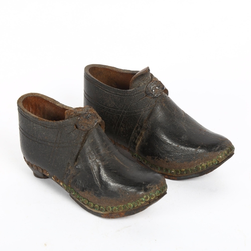 165 - A pair of Victorian child's leather clogs, with hand-hammered steel soles, length 13cm