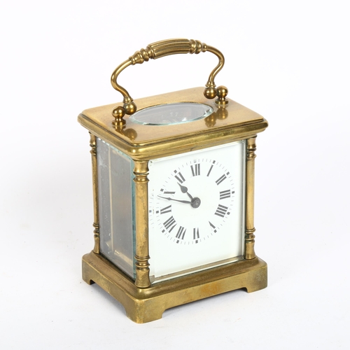 166 - A small brass-cased carriage clock, with white enamel dial and Roman numeral hour markers, case heig... 