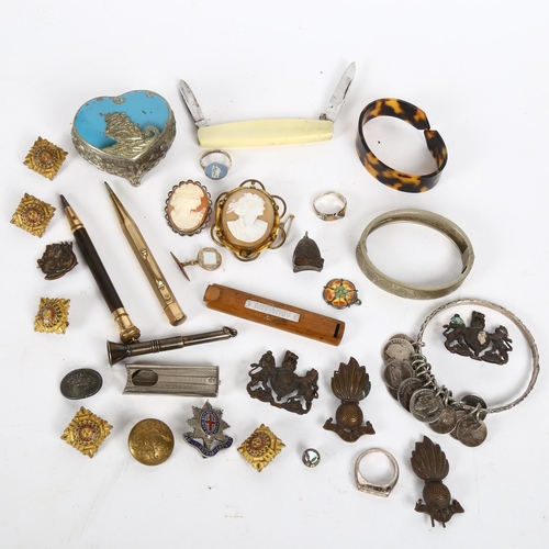 167 - Various collectables, including military cap badges, silver cigar piercer, coin bracelet, cameo broo... 
