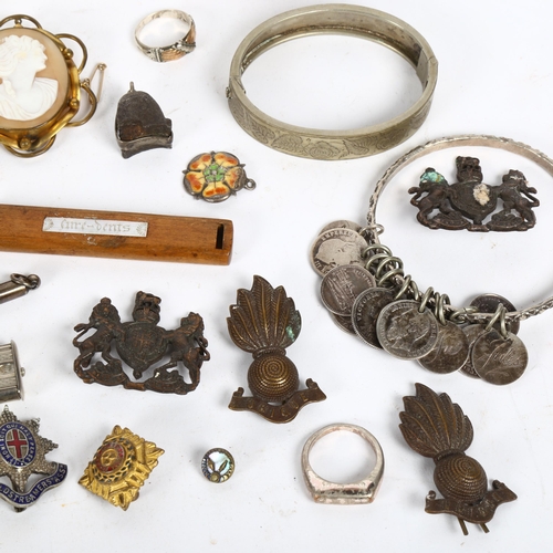 167 - Various collectables, including military cap badges, silver cigar piercer, coin bracelet, cameo broo... 