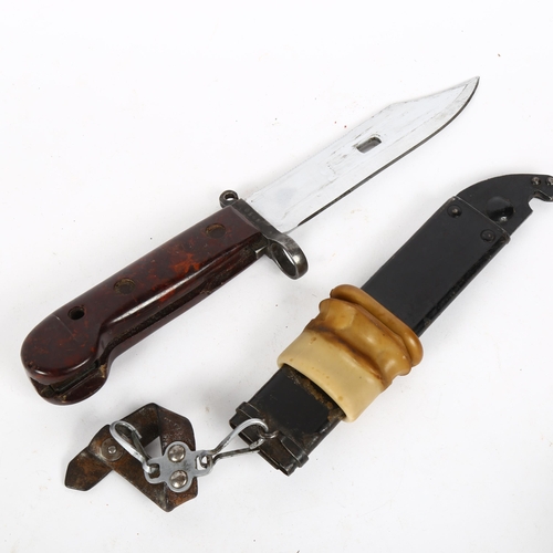 181 - A Yugoslavian AK74 bayonet and scabbard, blade length 15cm