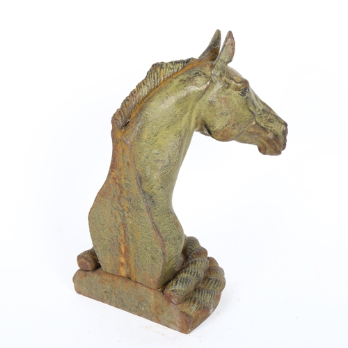 196 - A cast-iron horse-head door stop, height 24cm