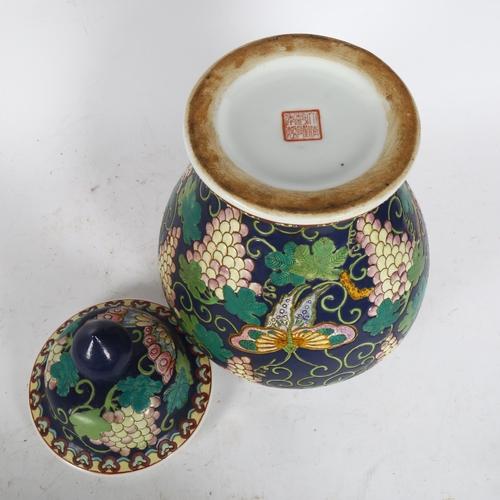 209 - A Chinese lavender ground butterfly and grape baluster jar and cover, character marks on base, heigh... 