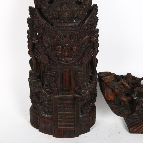 210 - A Chinese stained wood immortal sculpture, and a Balinese shrine sculpture, height 41cm (2)