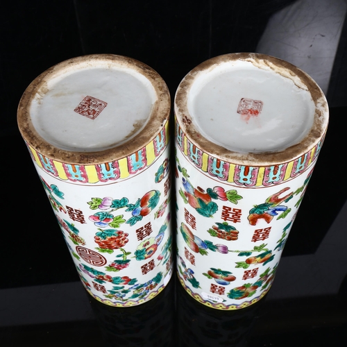 218 - A pair of Chinese famille verte fruit cylinder vases, marks on bases, height 28cm