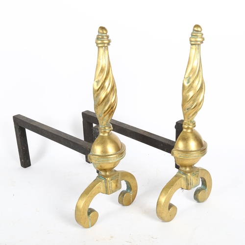 245 - A pair of cast-brass fire dogs, height 37cm