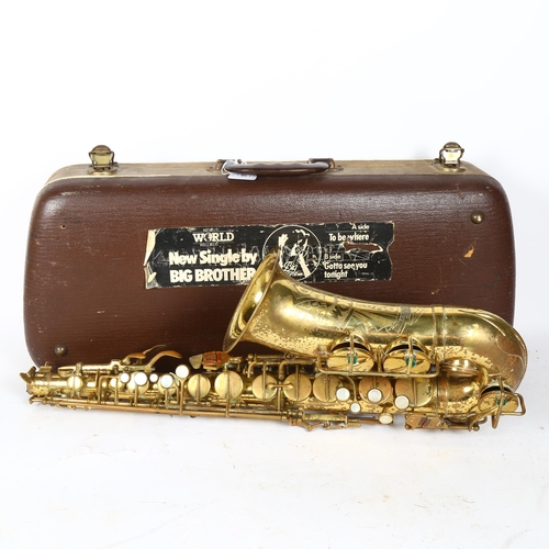 258 - A brass lacquered World saxophone, serial no. 24561, in hardshell case