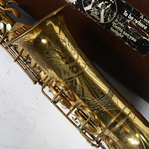 258 - A brass lacquered World saxophone, serial no. 24561, in hardshell case